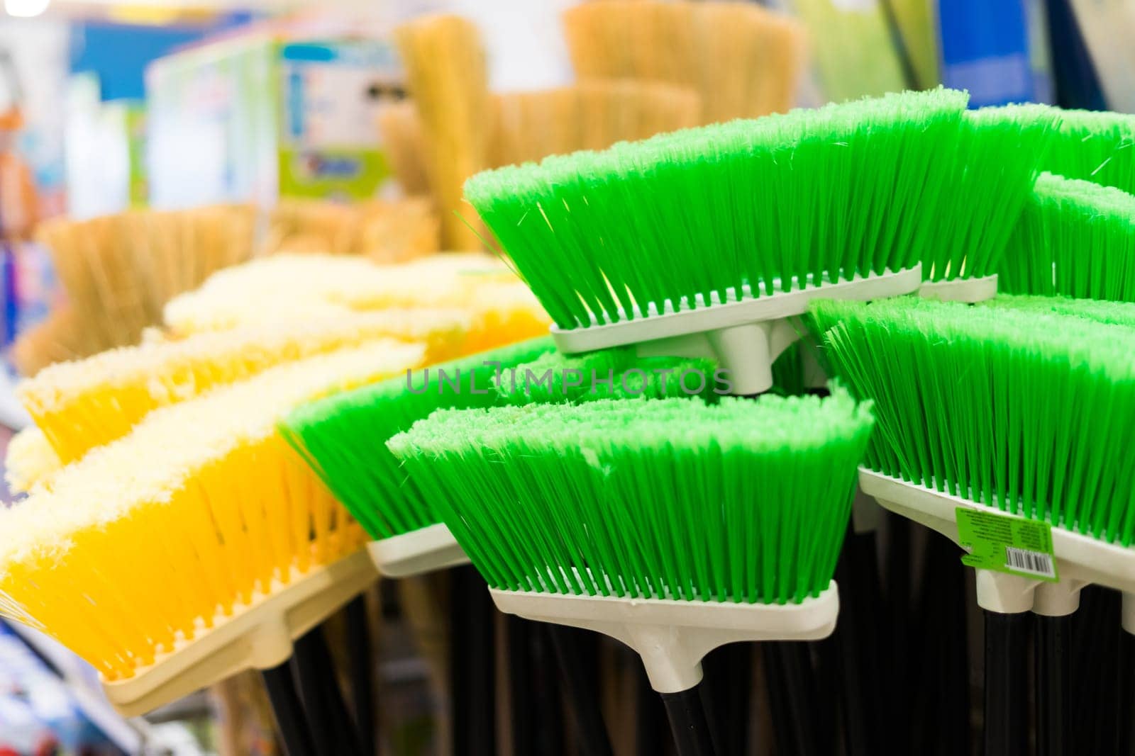 Large assortment of brushes for cleaning premises in store. Trade in floor cleaning equipment