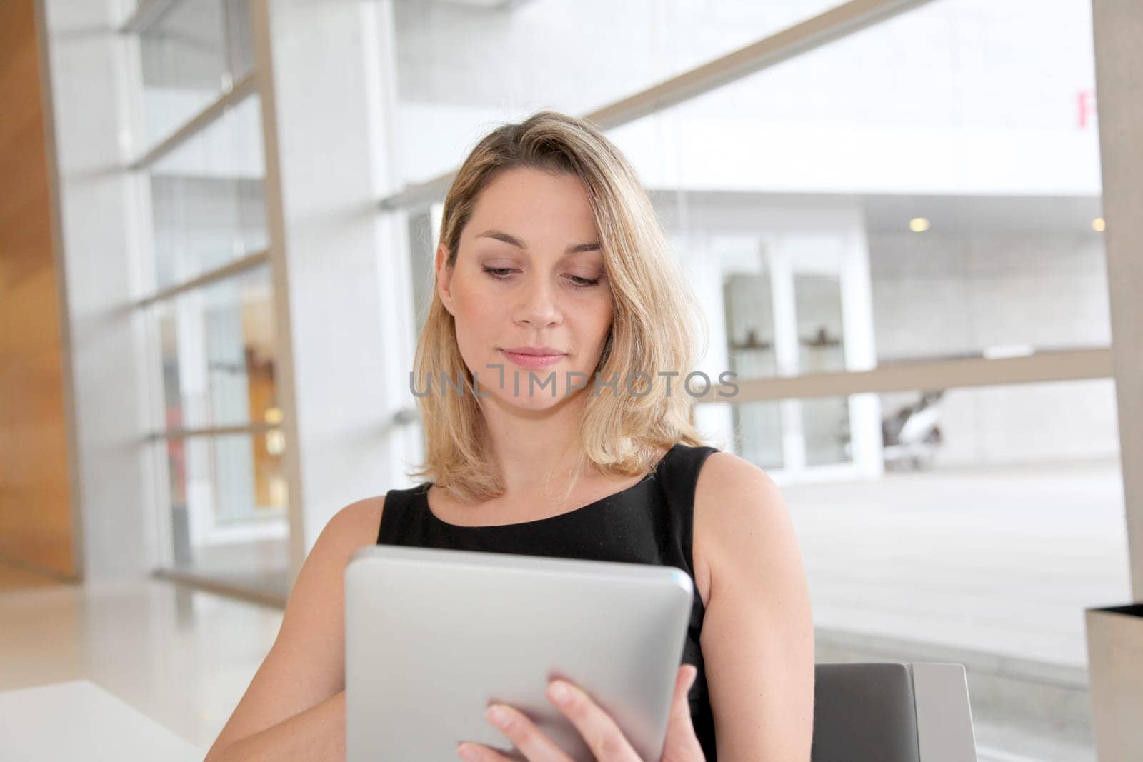 Businesswoman in the office working on electronic tab