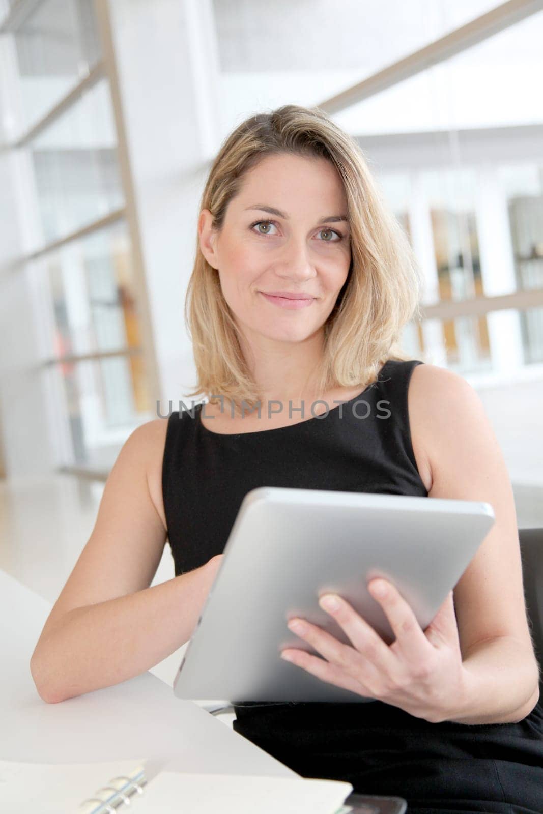 Businesswoman in the office working on electronic tab