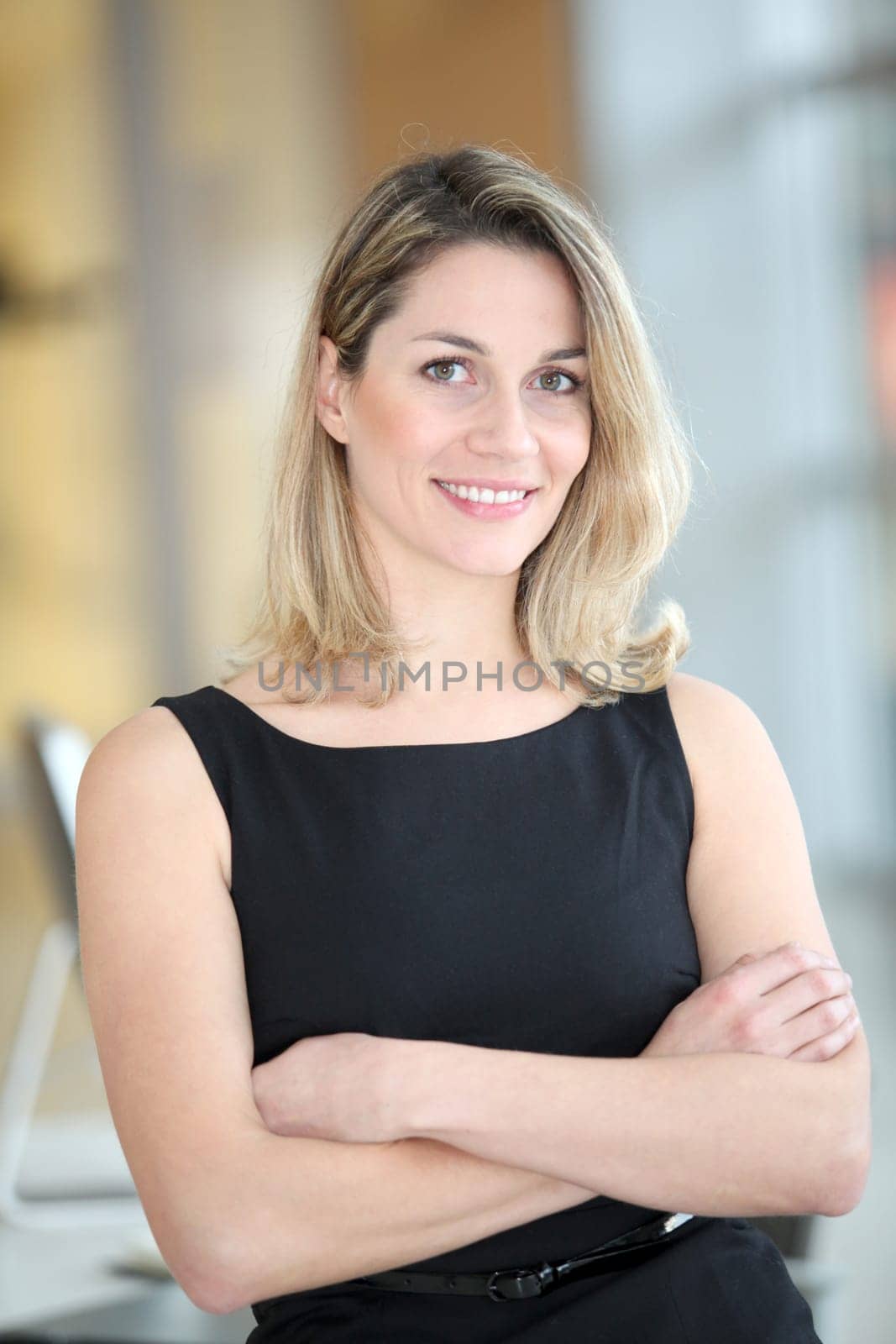 Portrait of beautiful businesswoman with arms crossed