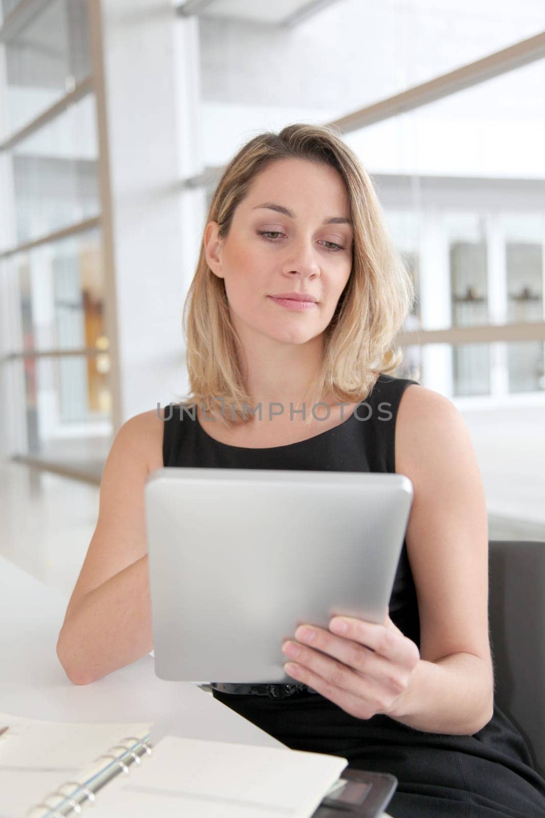 Businesswoman in the office working on electronic tab