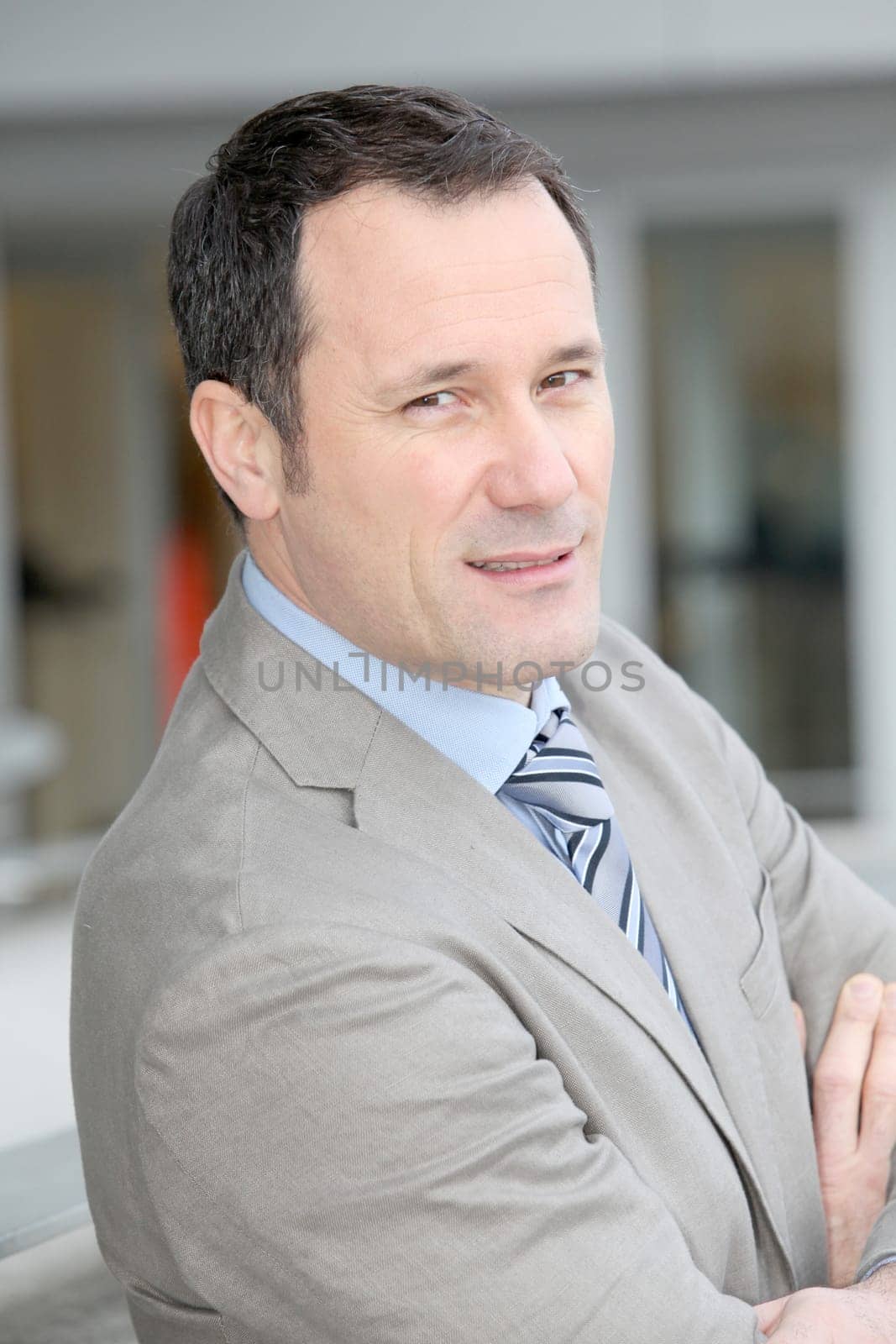 Businessman standing outside the office