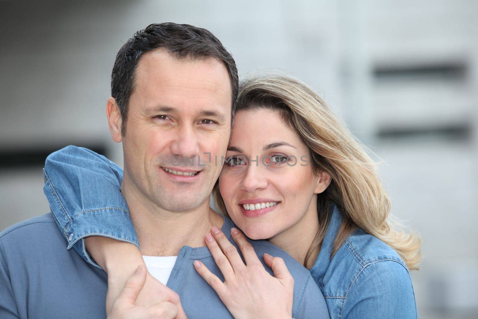 Portrait of happy couple standing outdoors