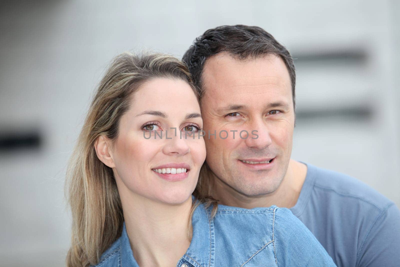 Portrait of happy couple standing outdoors