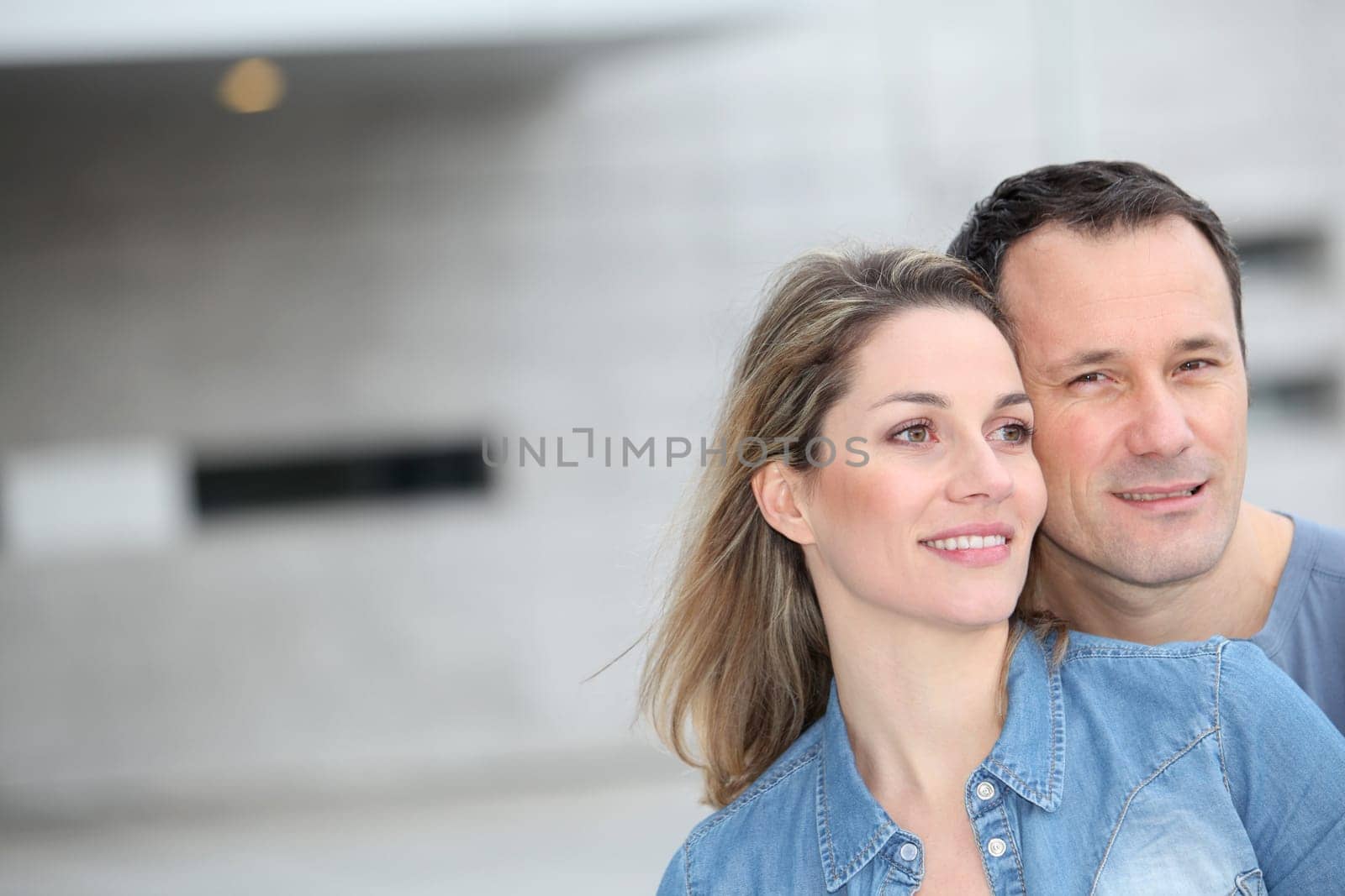 Portrait of happy couple standing outdoors