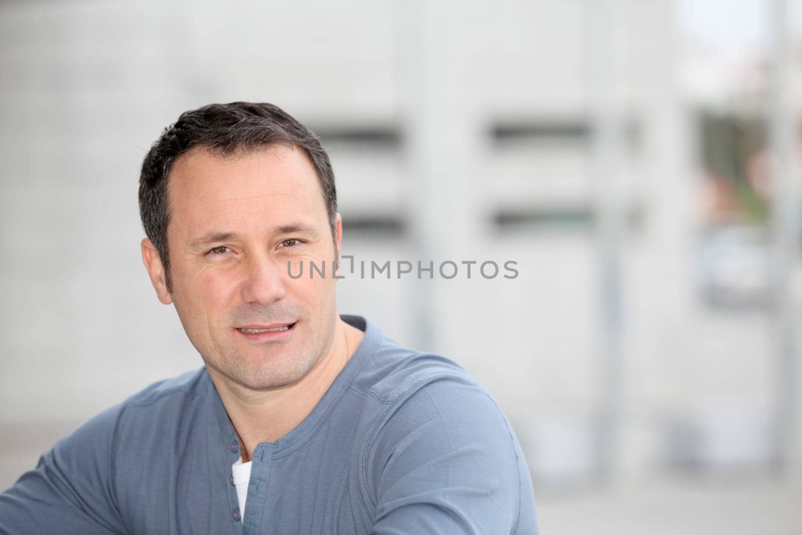 Portrait of hansome man standing in the street
