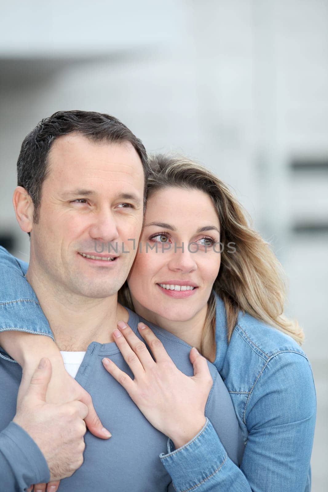 Portrait of happy couple standing outdoors
