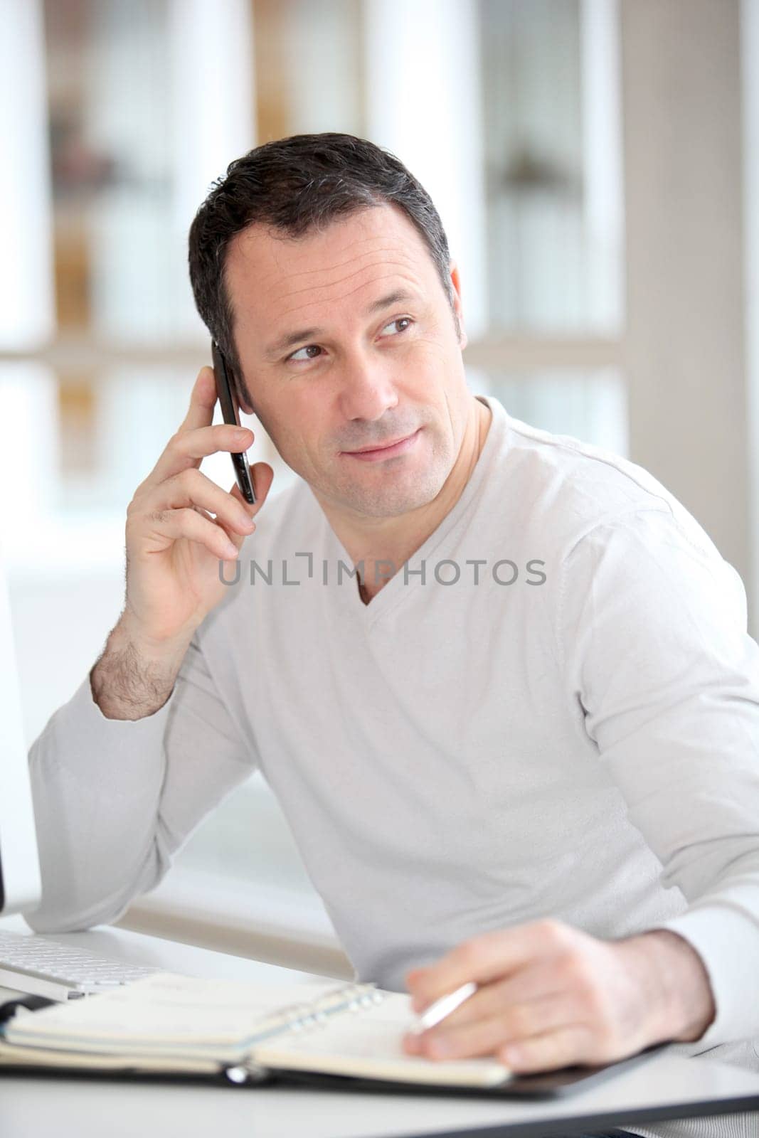 Salesman on the phone in the office