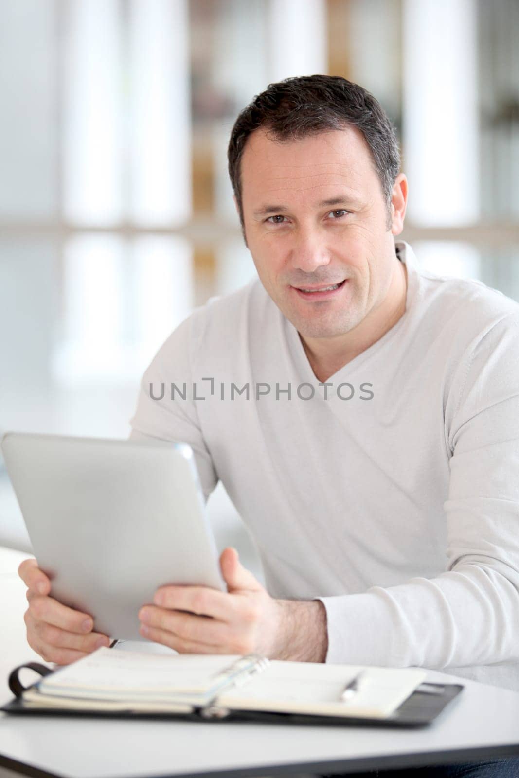 Office worker in the office using electronic tab