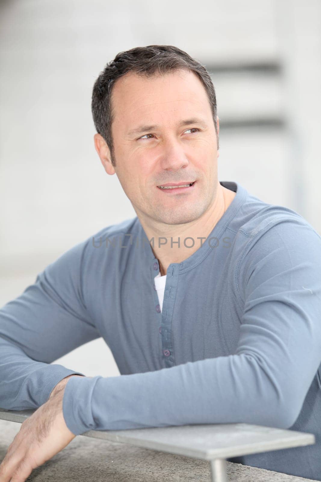 Portrait of hansome man standing in the street