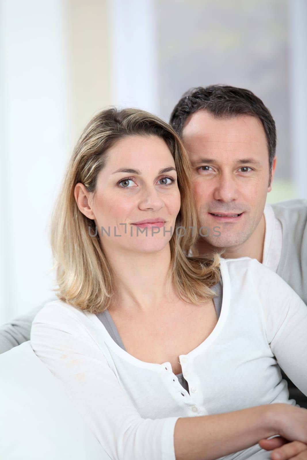 Portrait of happy couple at home