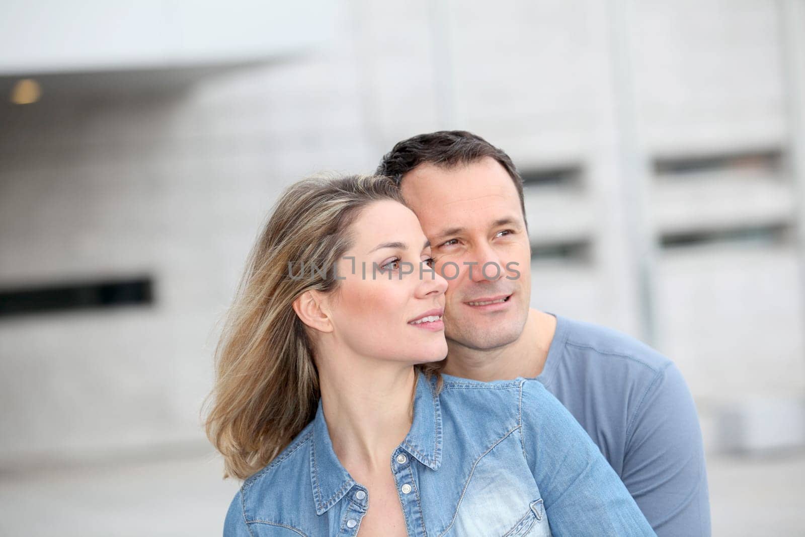 Portrait of happy couple standing outdoors