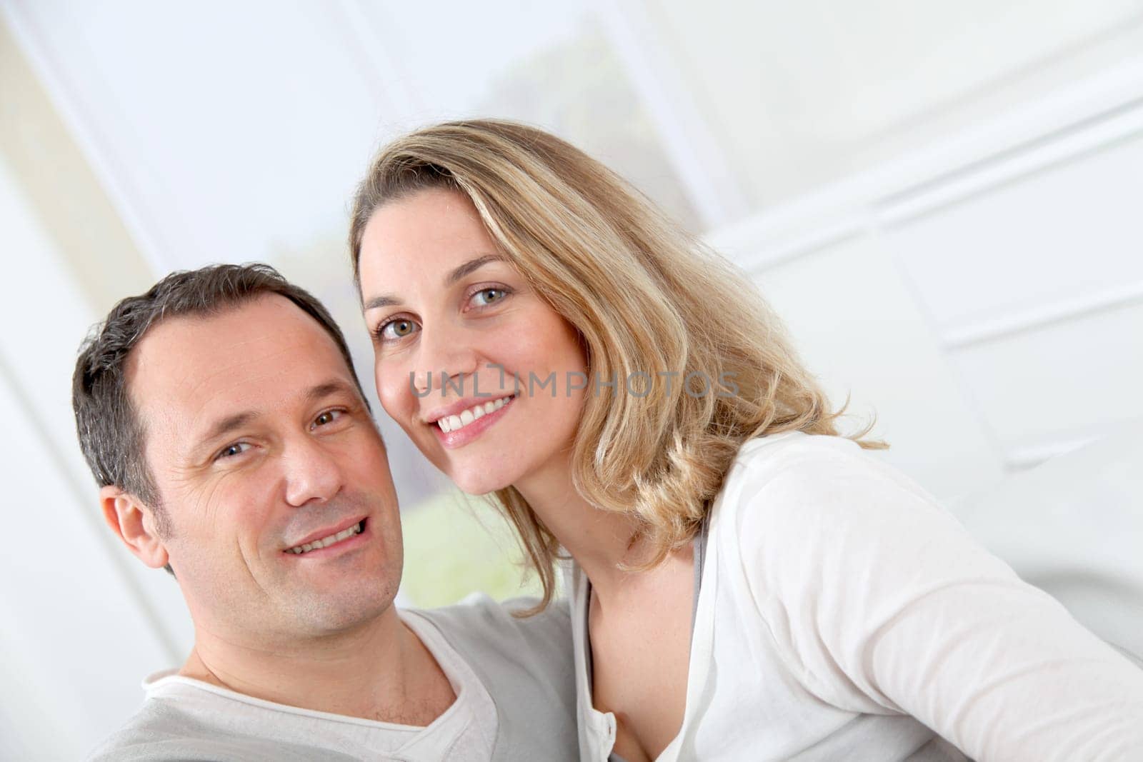 Portrait of happy couple at home