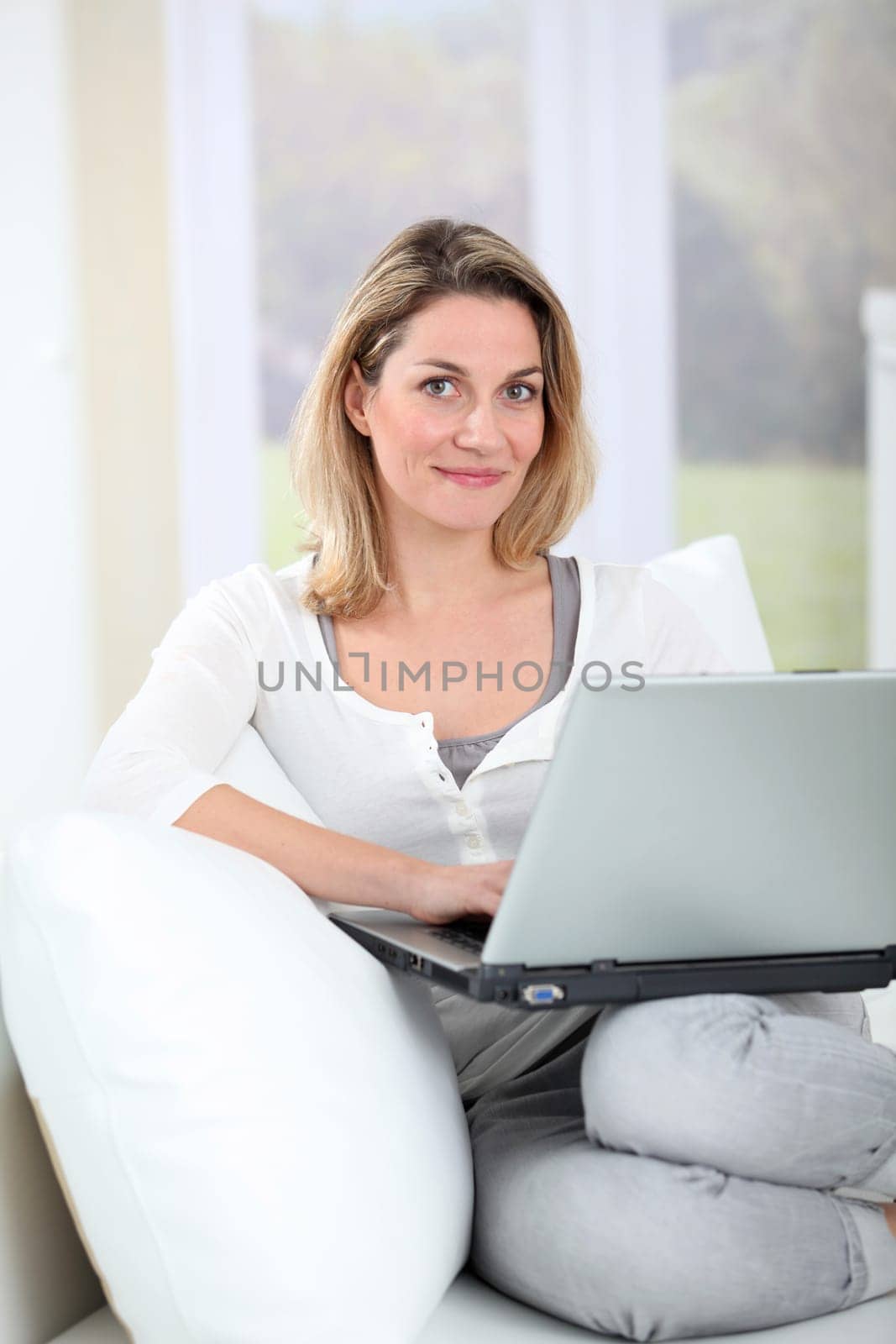 Woman using laptop computer at home