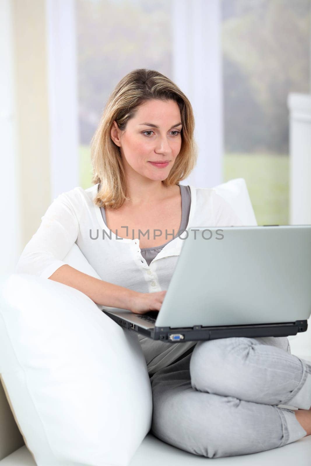 Woman using laptop computer at home