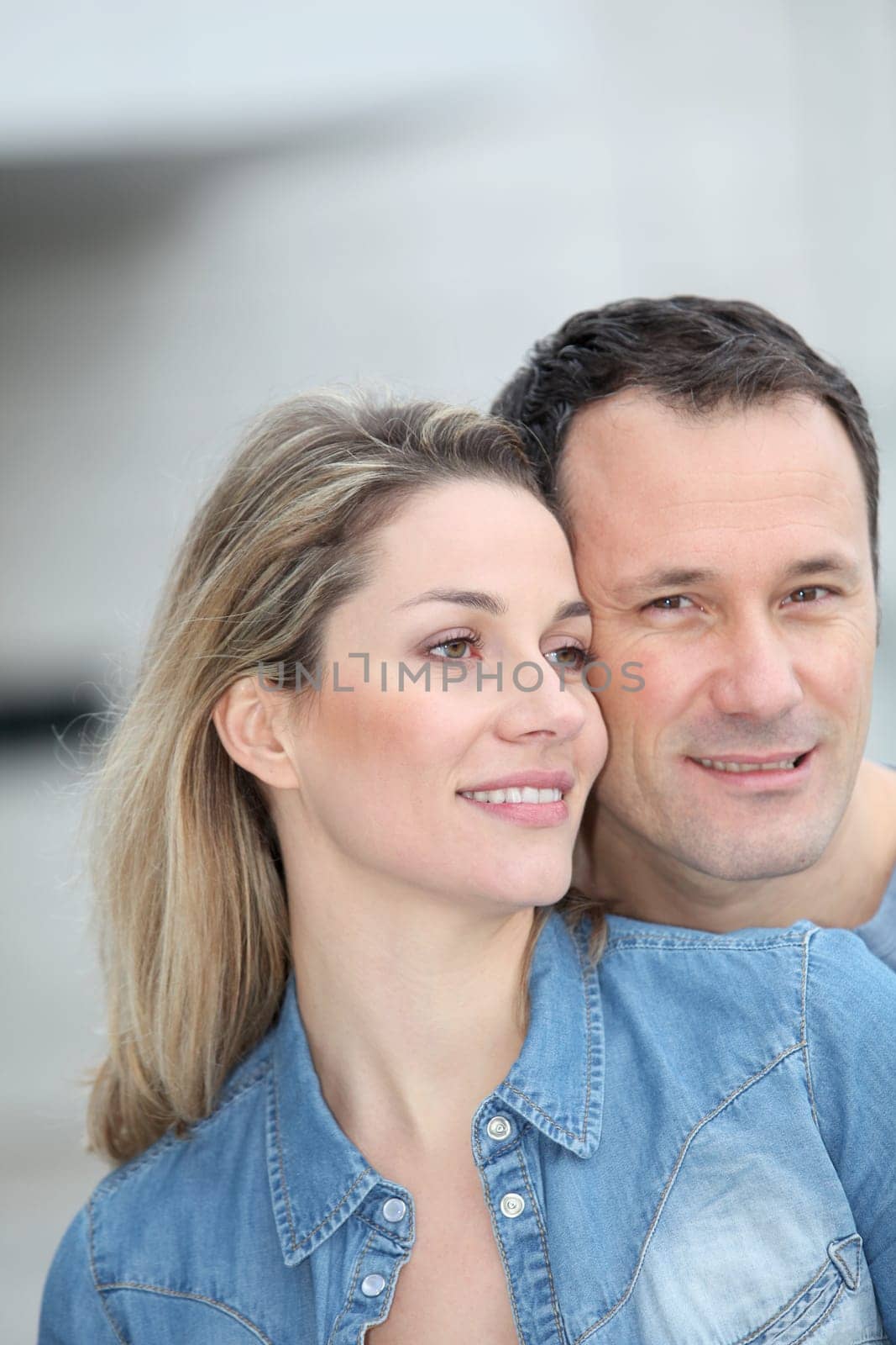 Portrait of happy couple standing outdoors