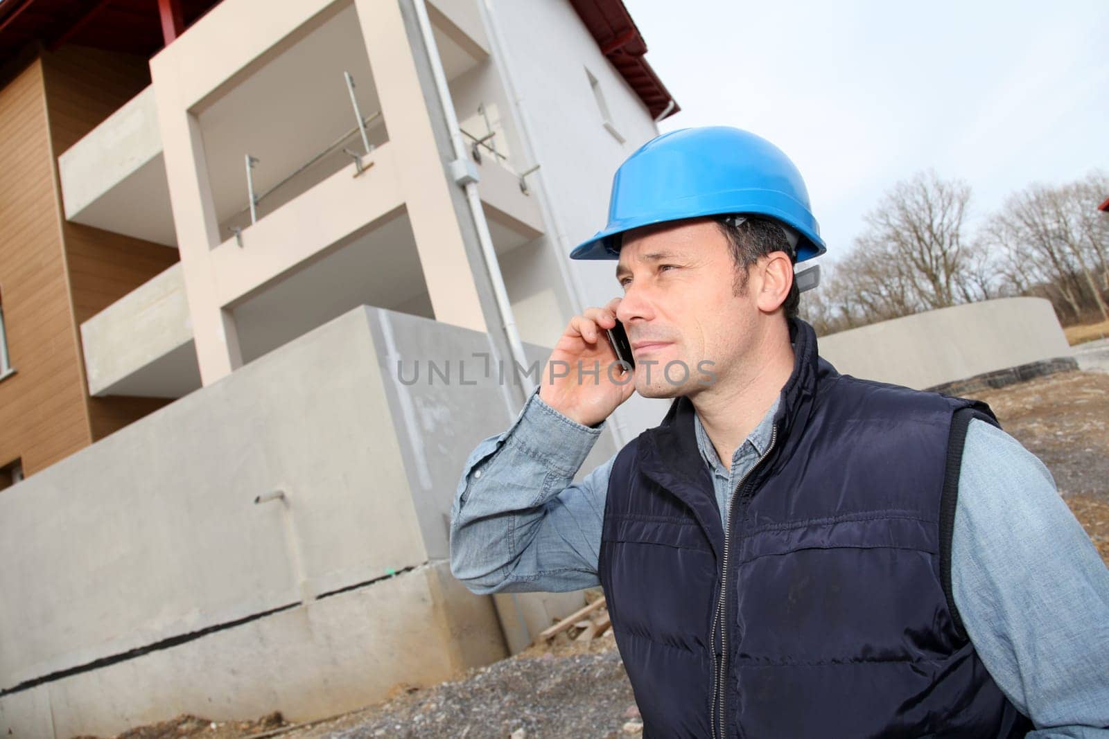 Supervisor talking on the phone on construction site