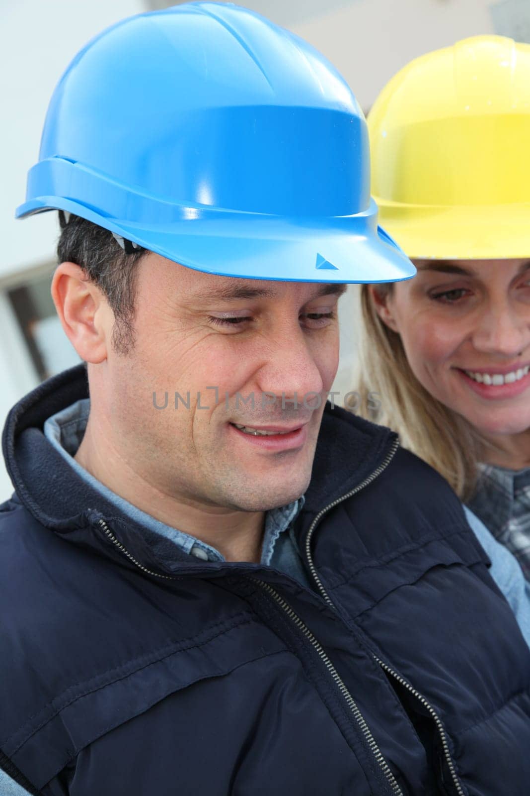 Closeup of architects with security helmets