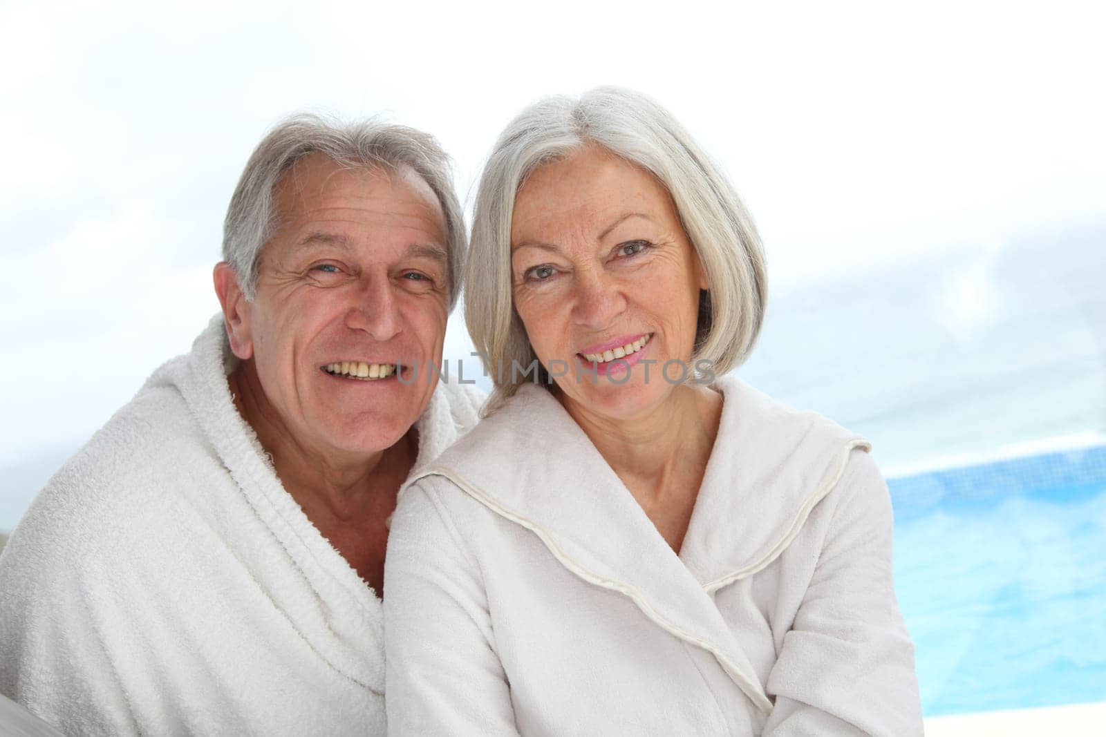 Portrait of happy senior couple in spa center