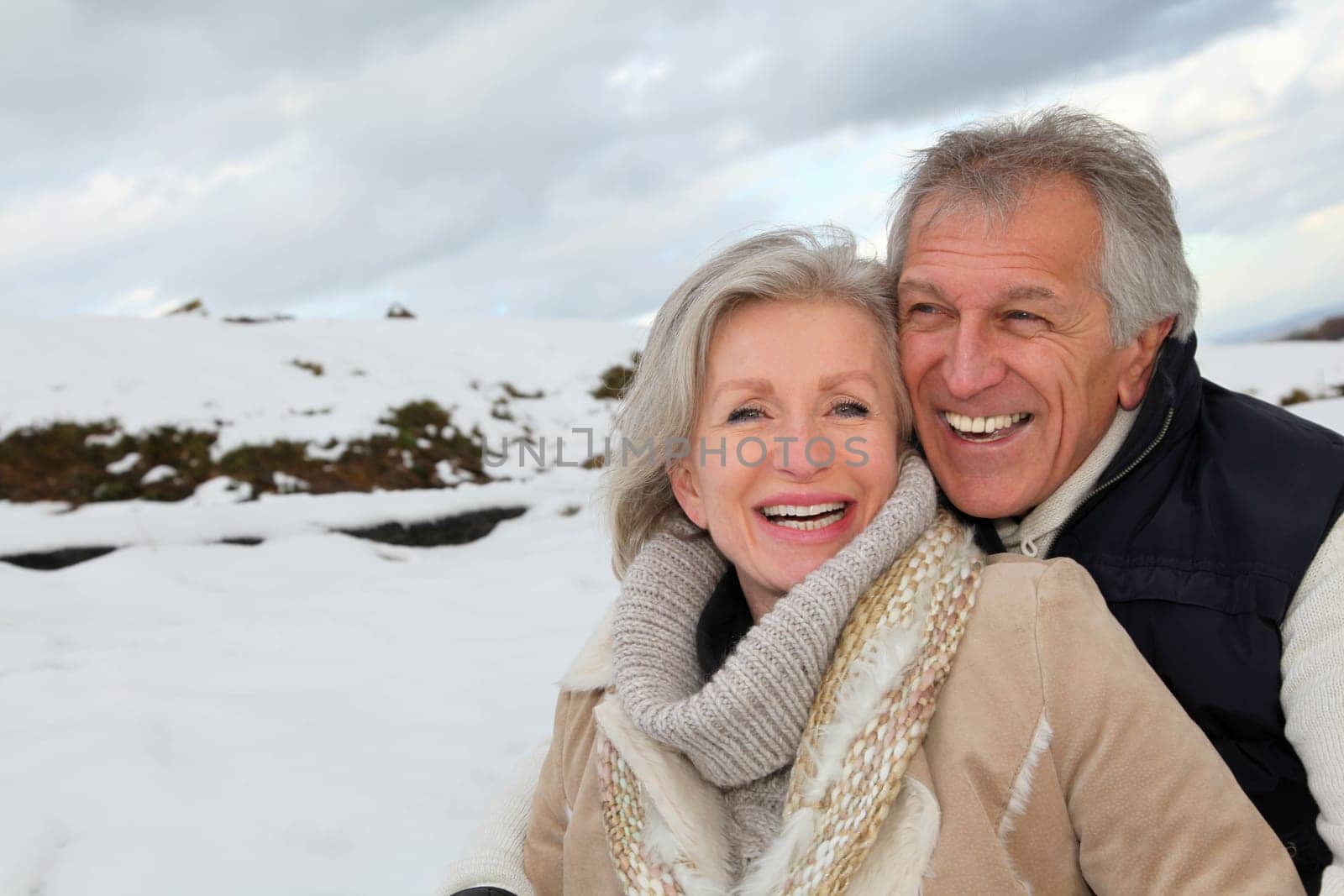 Portrait of happy senior couple at the mountain