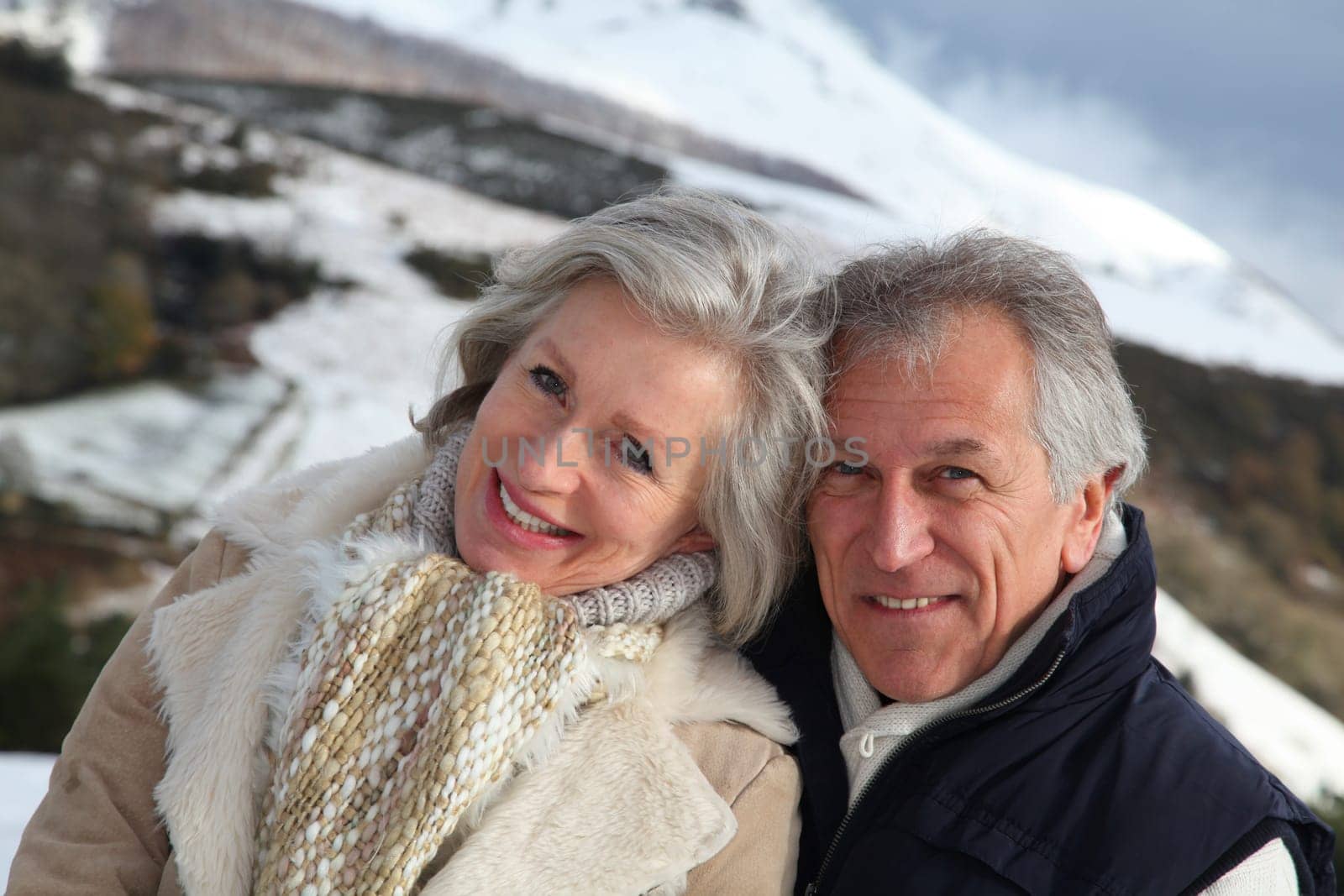 Portrait of happy senior couple at the mountain
