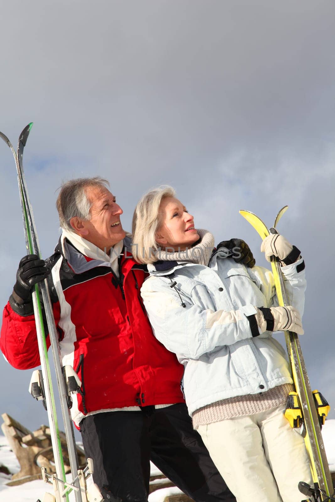 Senior couple having fun at ski resort