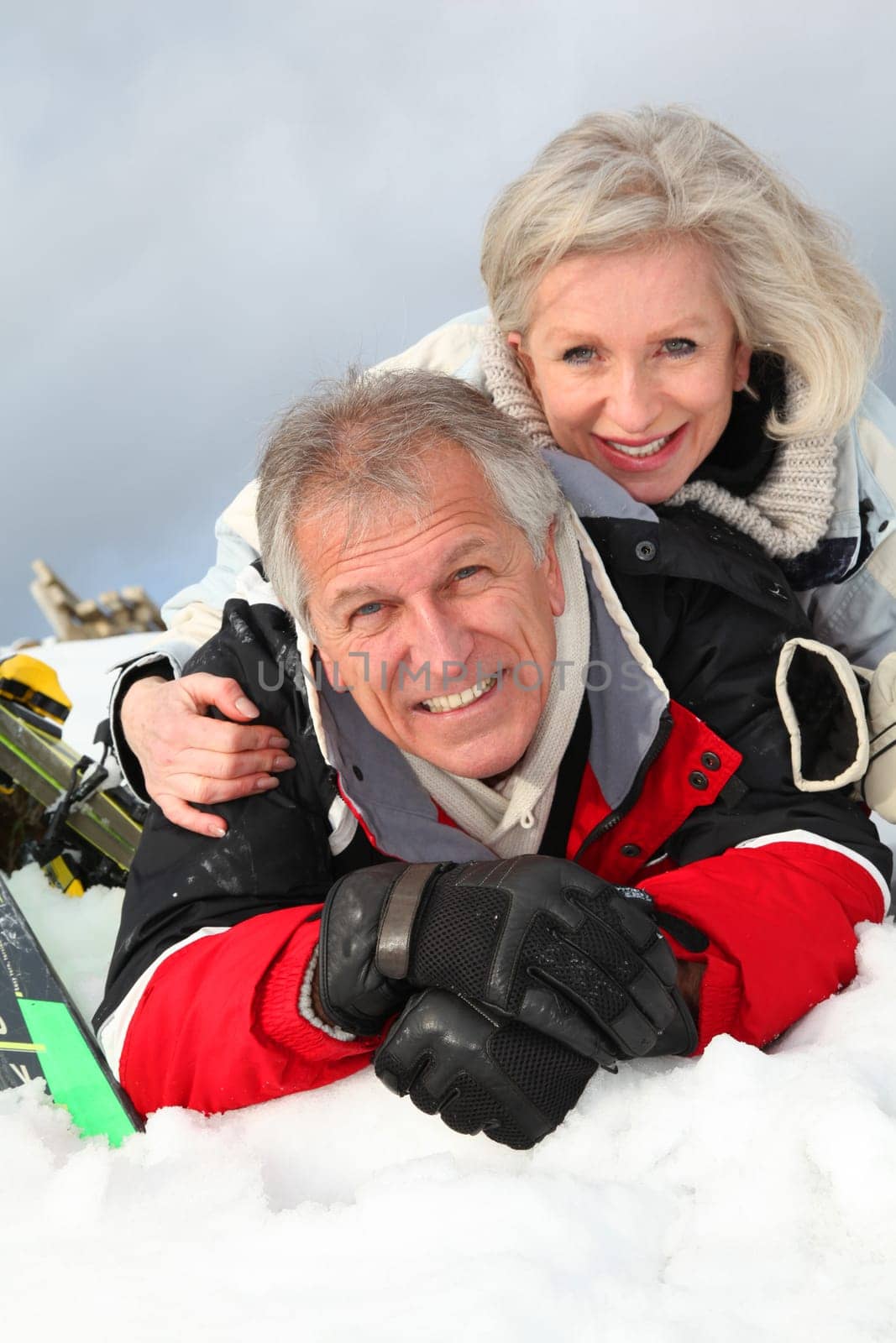 Senior couple having fun at ski resort