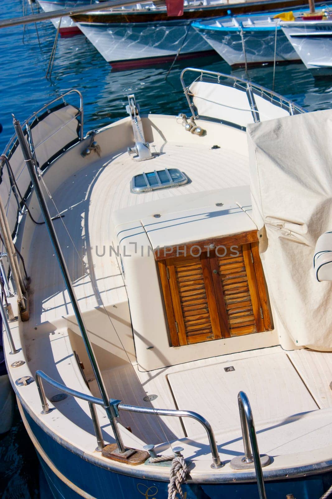 Boat in Capri port with boats in background