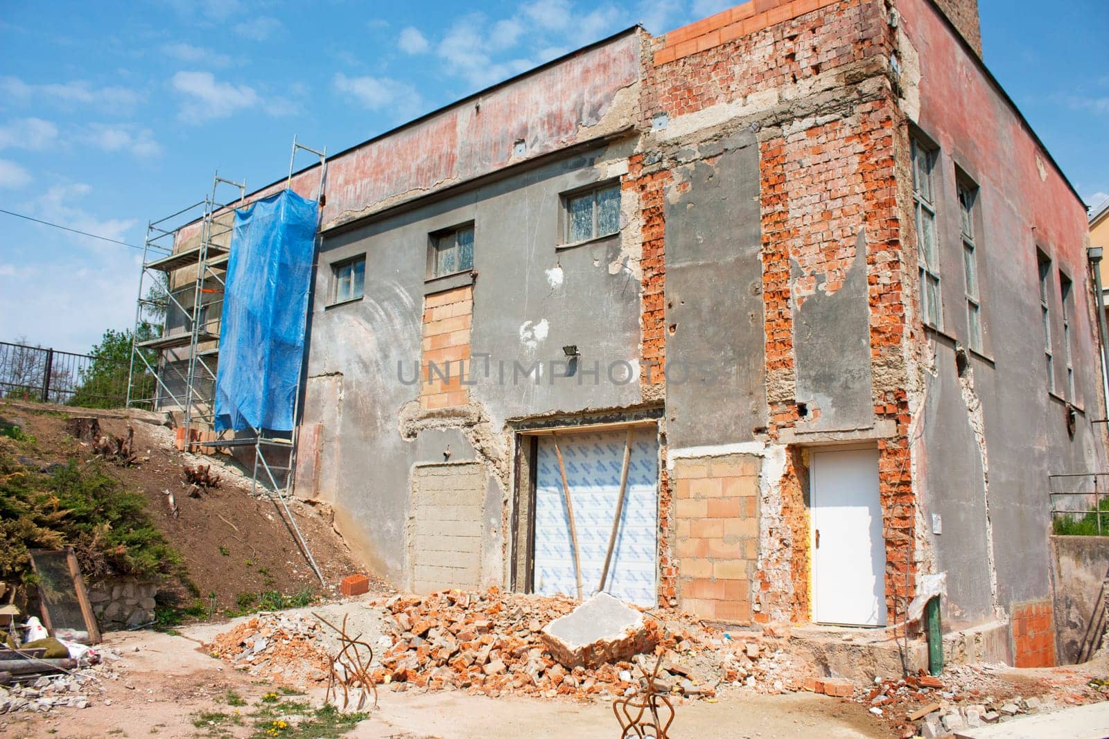 Reconstruction of a big house, scaffolding, bricks.