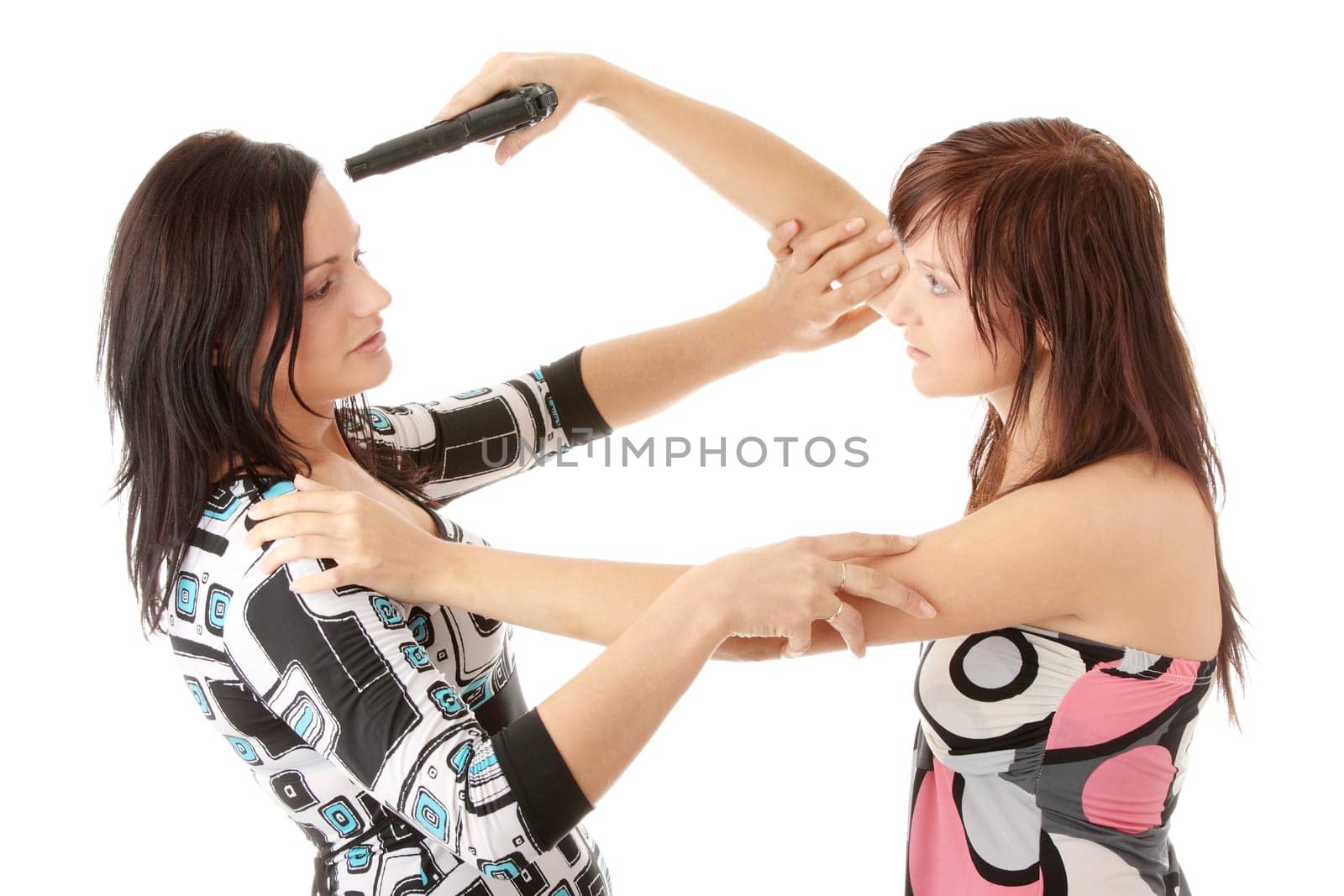 Woman with the gun wishes to shoot at the girlfriend.