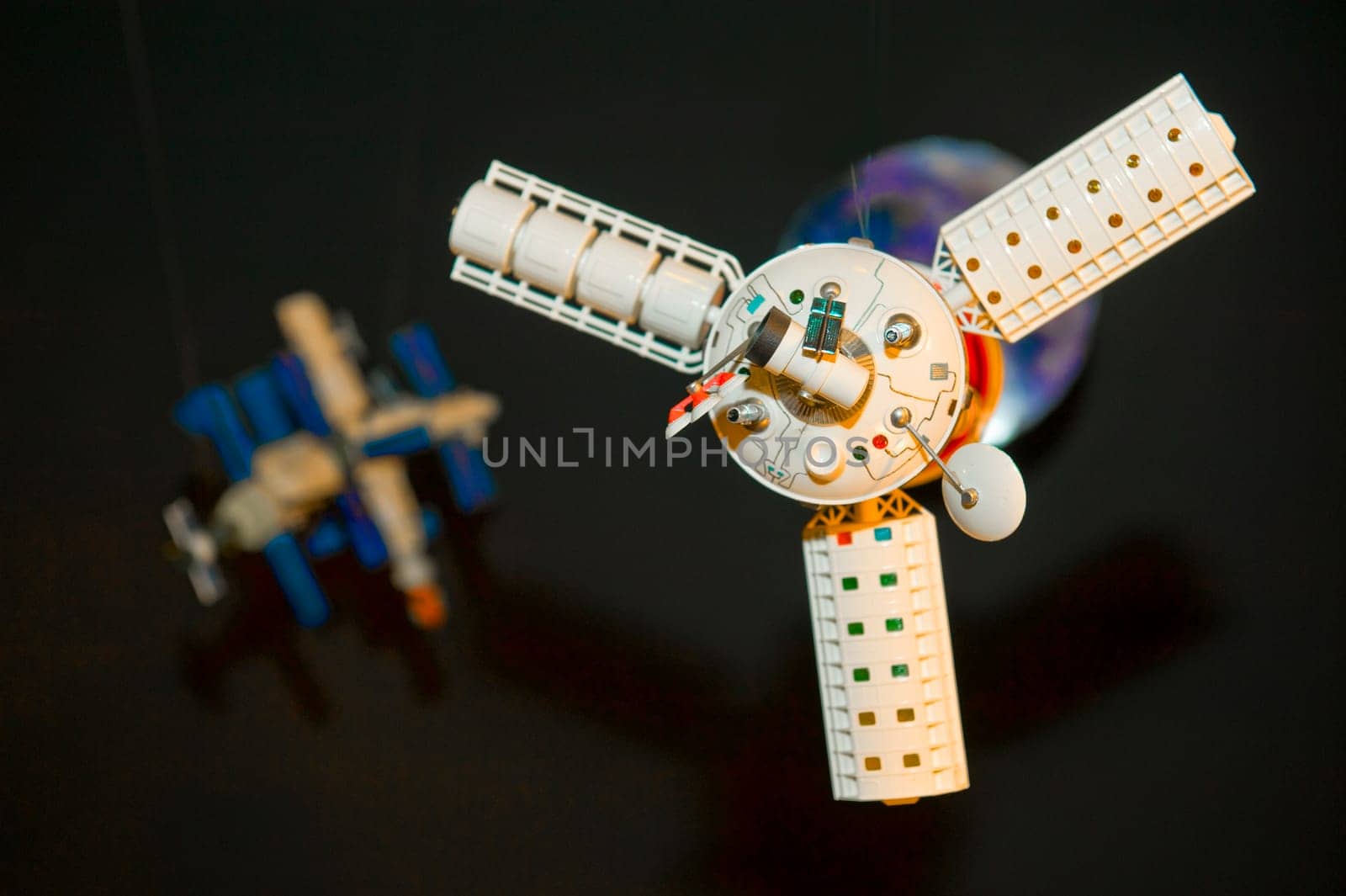 Model of space satellite taken as macro