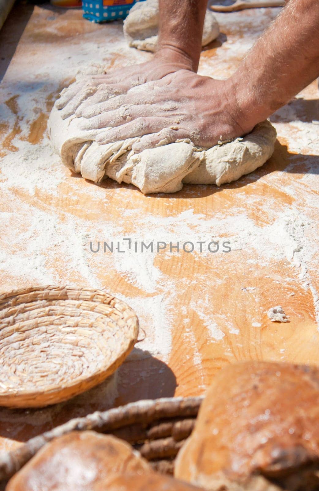 Baker kneading dough made with biological products