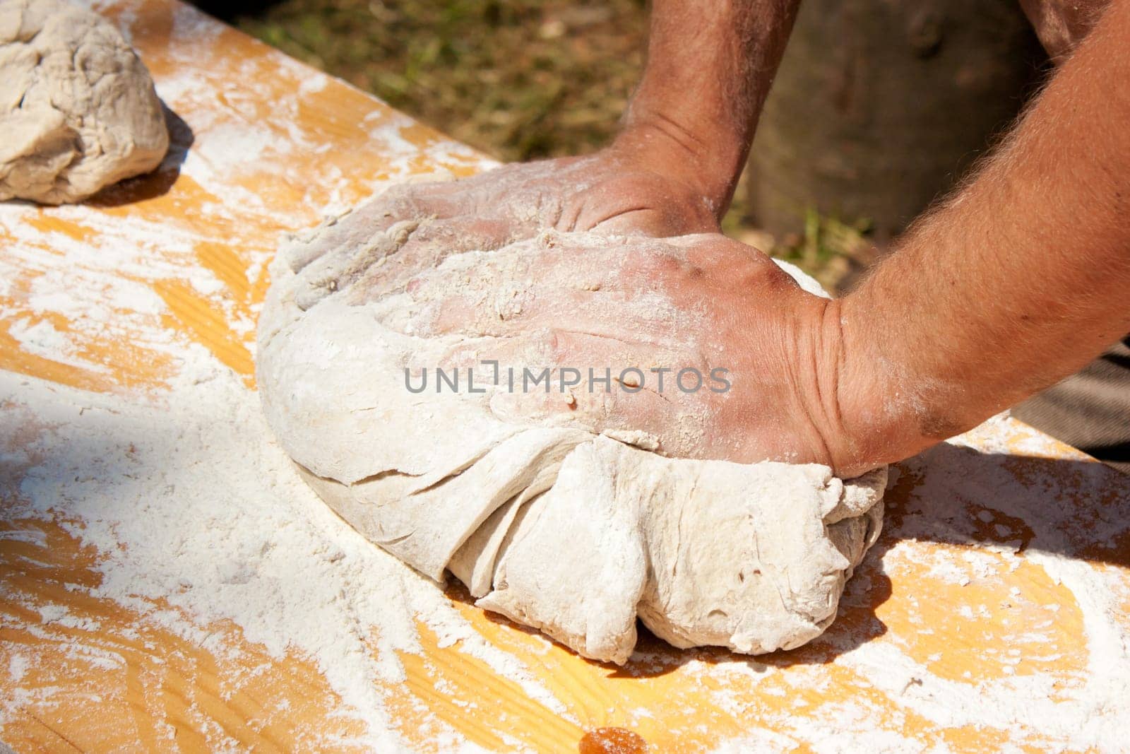 Baker kneading dough made with biological products