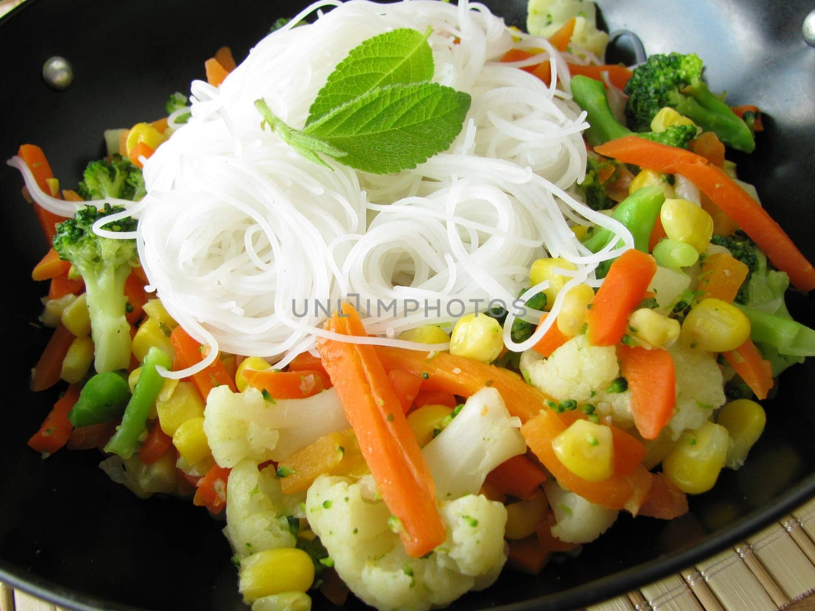 Vegetables with rice noodles and pineapple sage from the wok