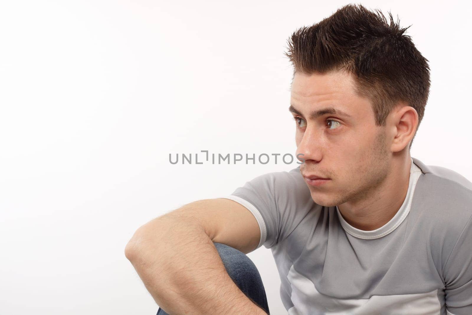 Young sportsman looking on his right side