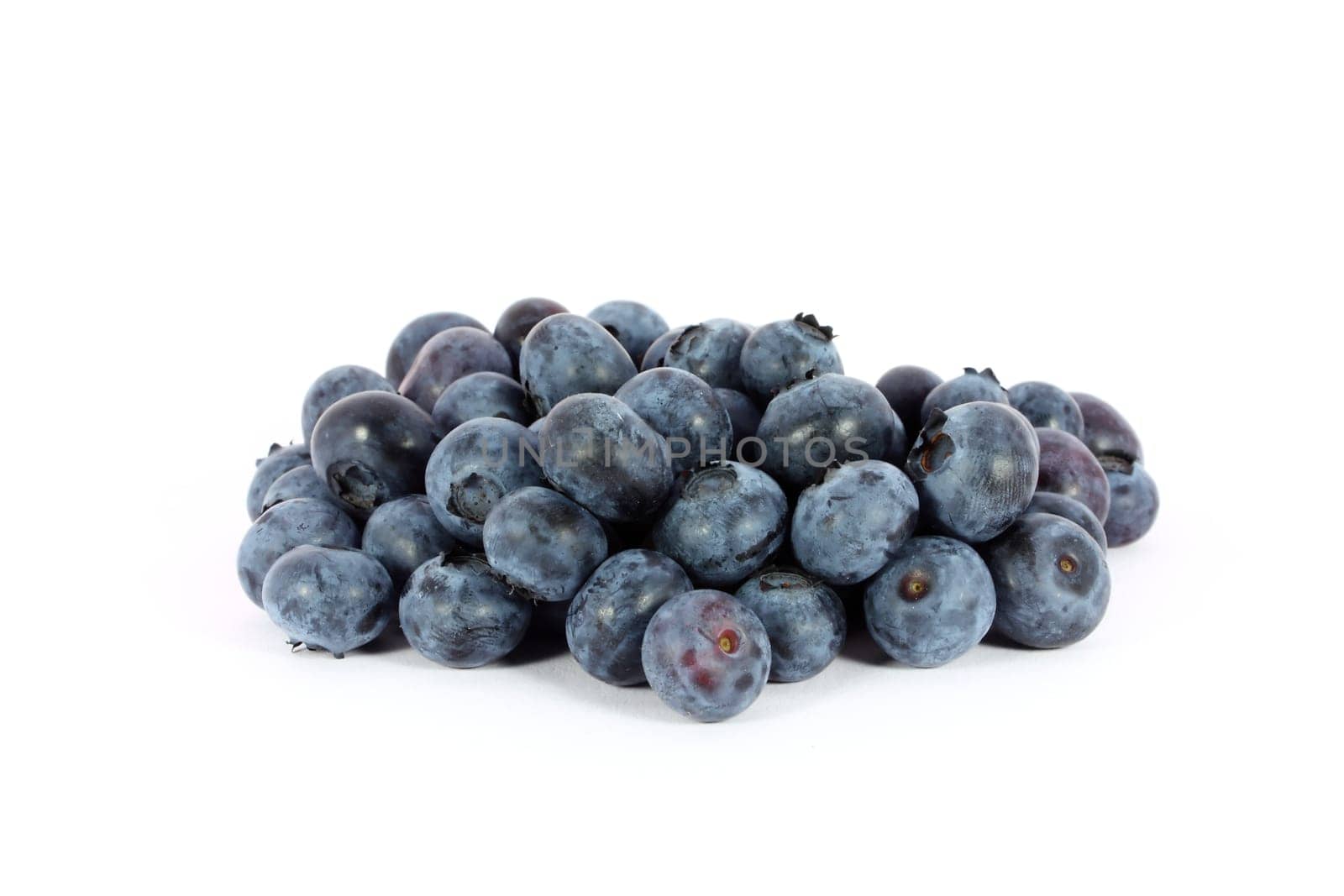 Heap of sweet juicy blueberries isolated on white