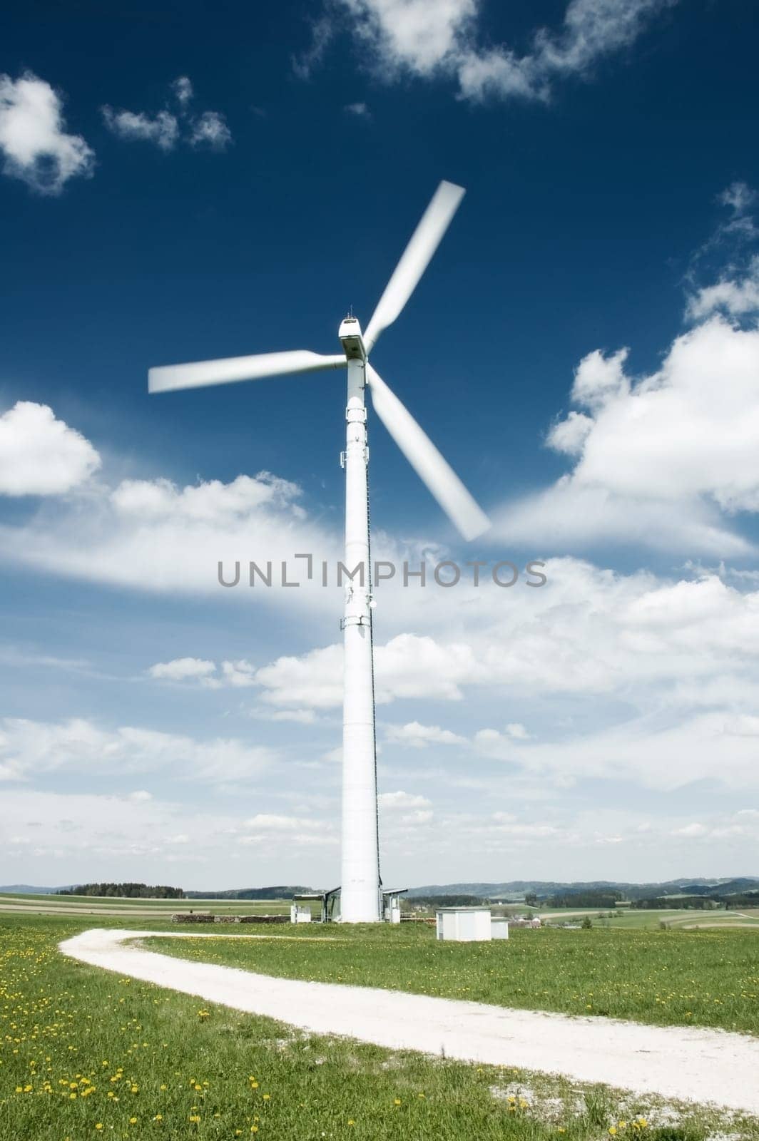 Path in a meadow leading to the Wind Turbine