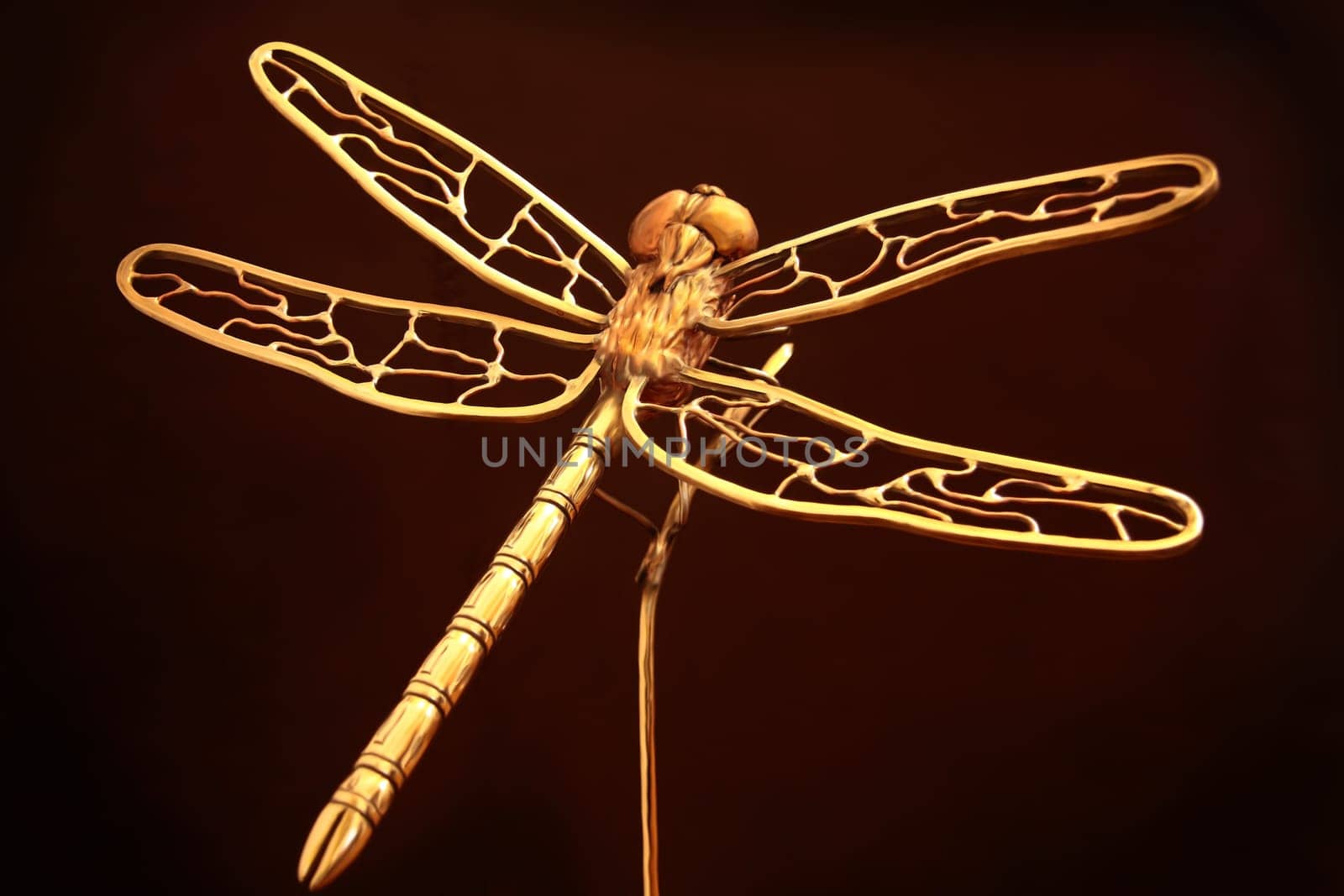 Large metal sculpture of a dragonfly