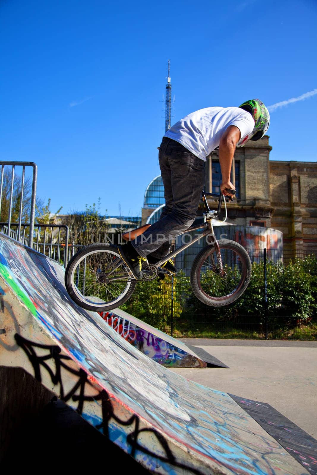 BMX biker performing tricks on a ramp