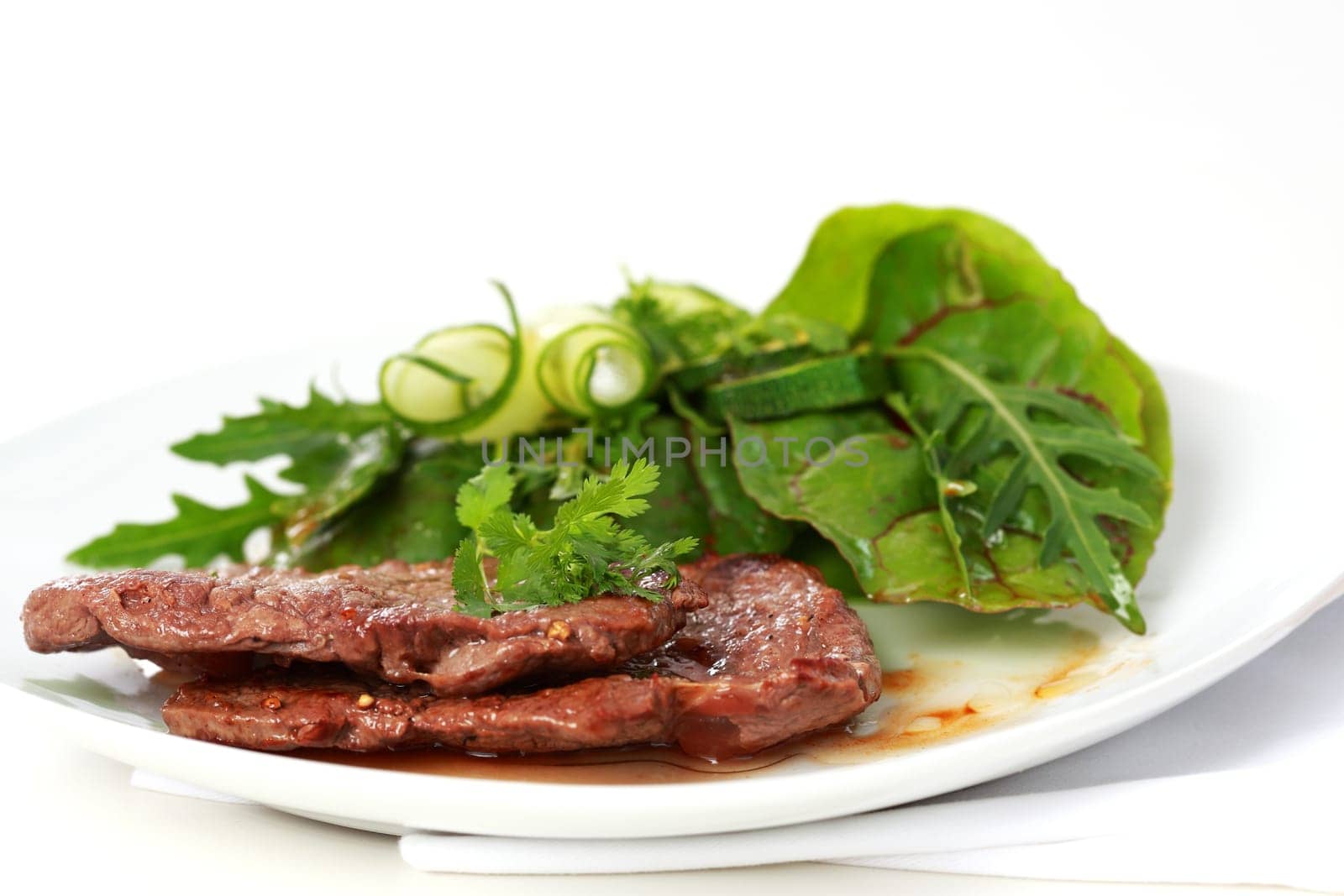 Beef steak with mixed green salad