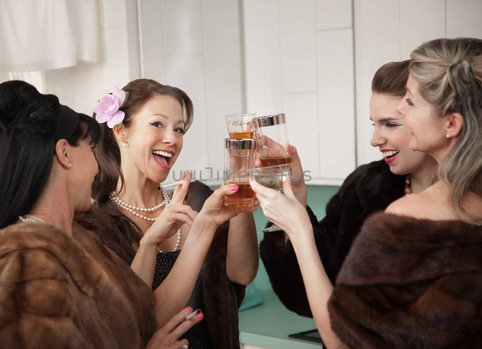Group of four retro fashion housewives tell secrets in the kitchen