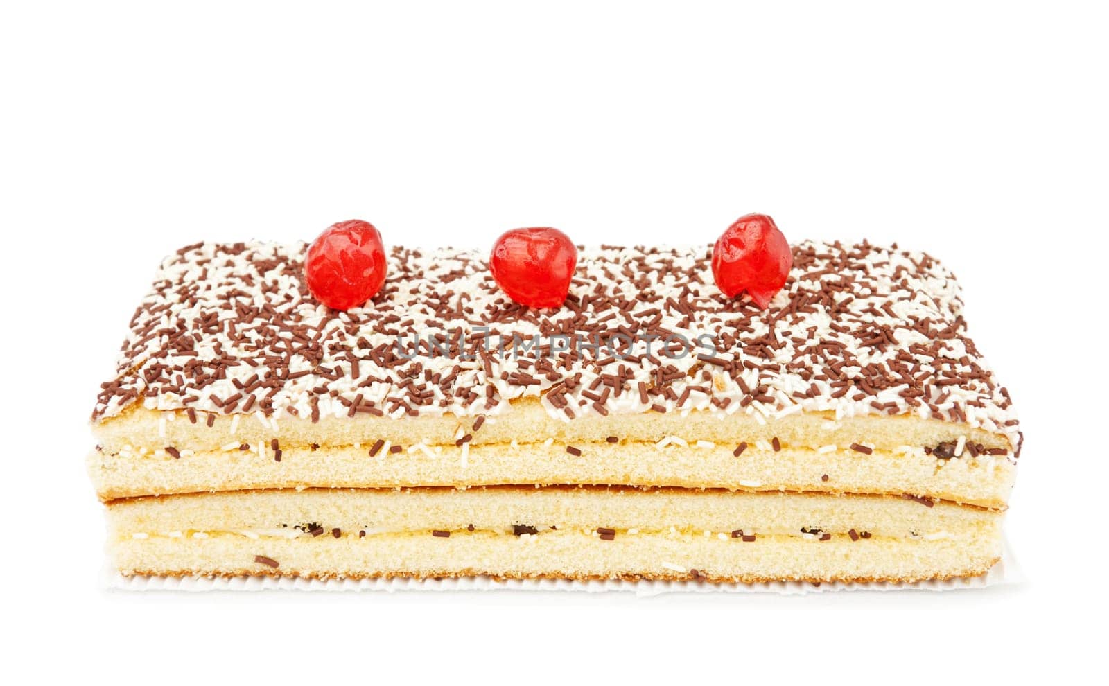 Freshly baked chocolate and coconut cake with cherries on top. Isolated over white background.