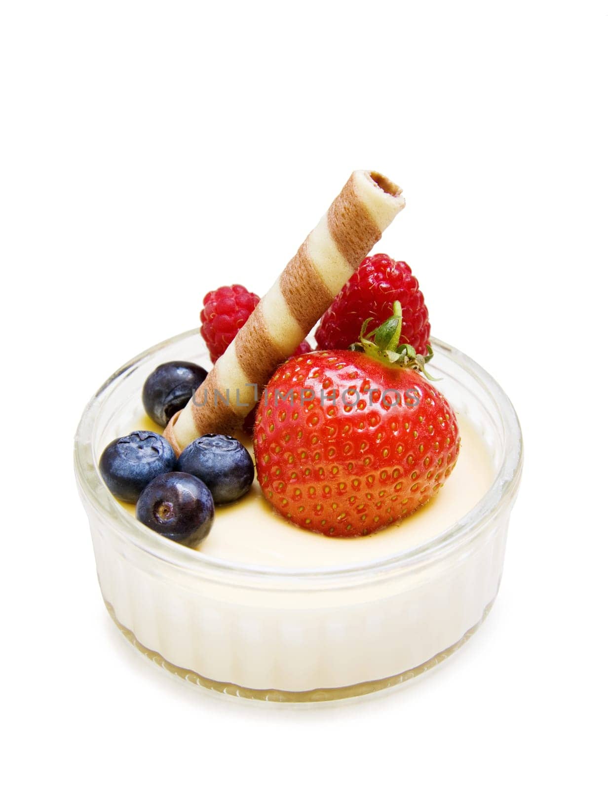 Delicious dessert - creme brulee with strawberry, raspberry, blueberry and chocolate waffle isolated on white.