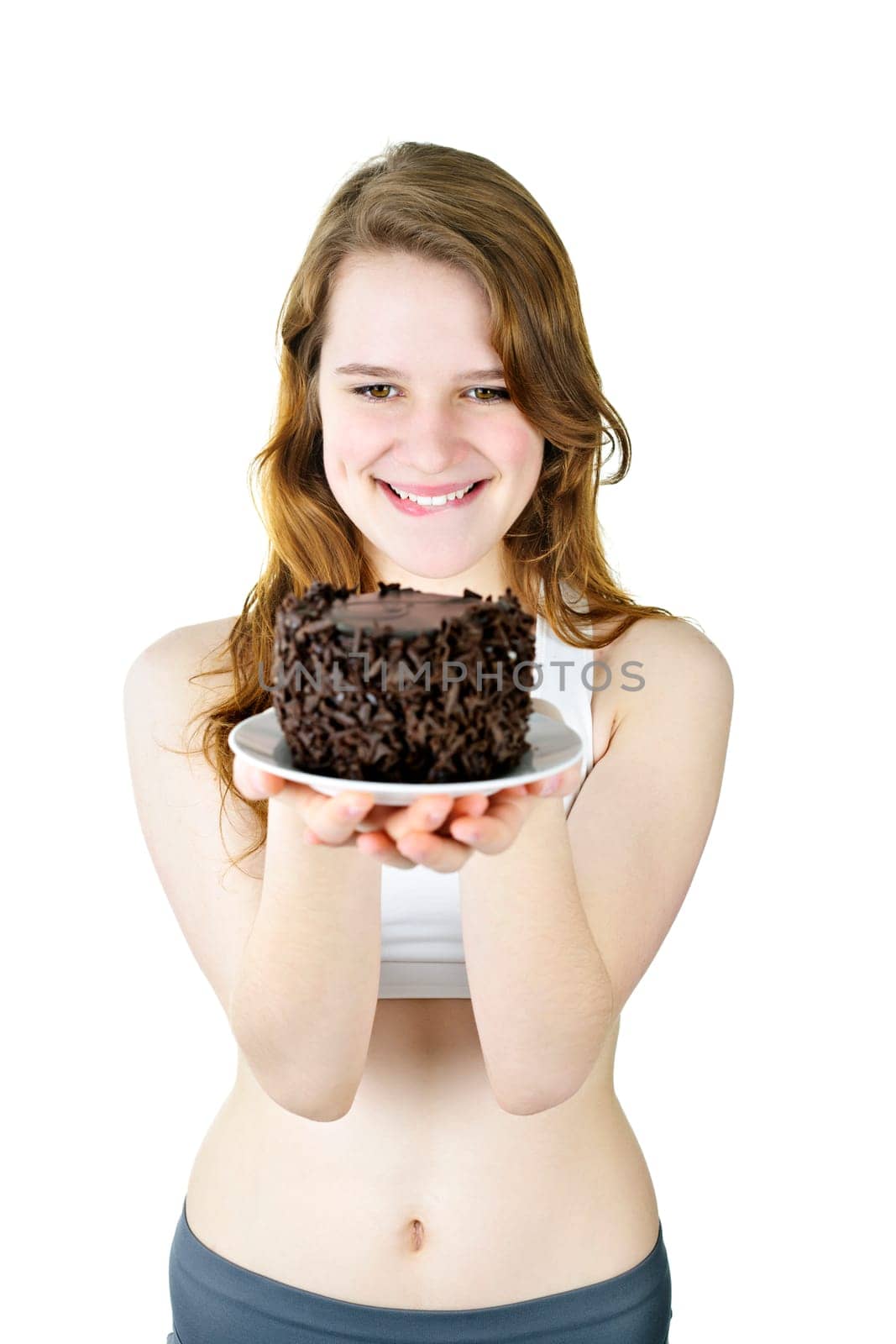 Smiling young woman tempted by a delicious chocolate cake