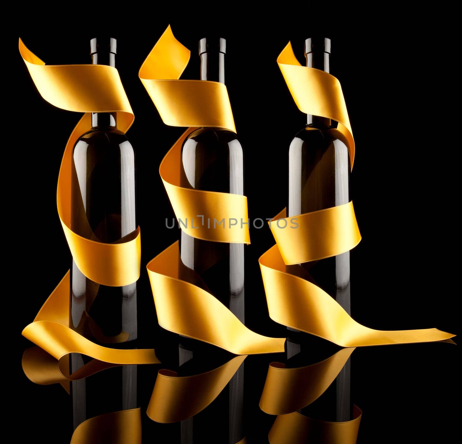 Gold ribbons around bottles