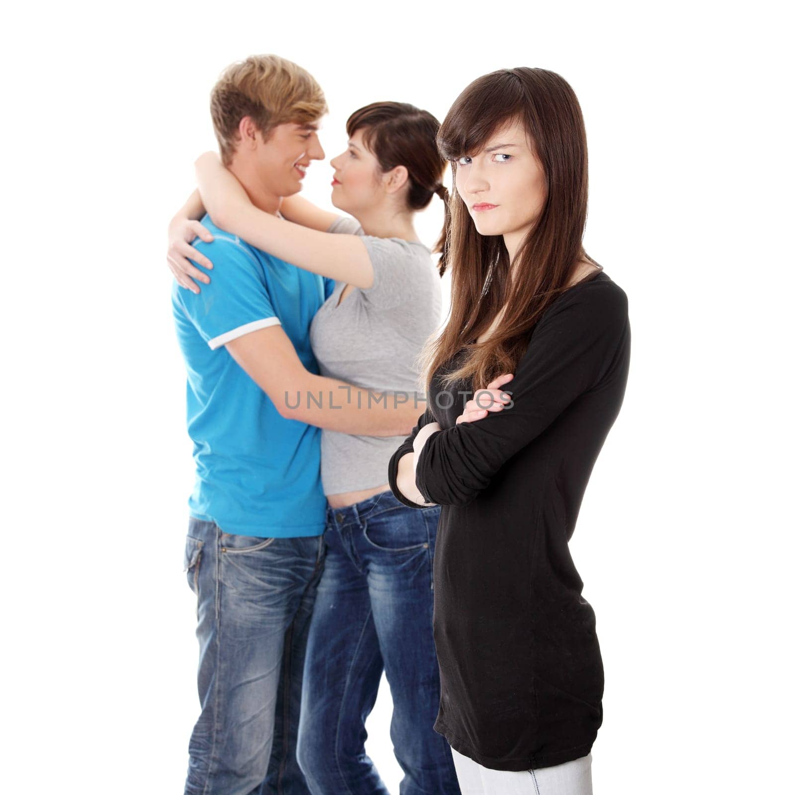 Sad brunette girl jealousy about her friend. Isolated on white background.