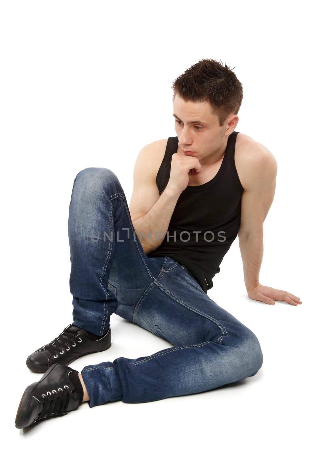 Young man thinking and hand resting on