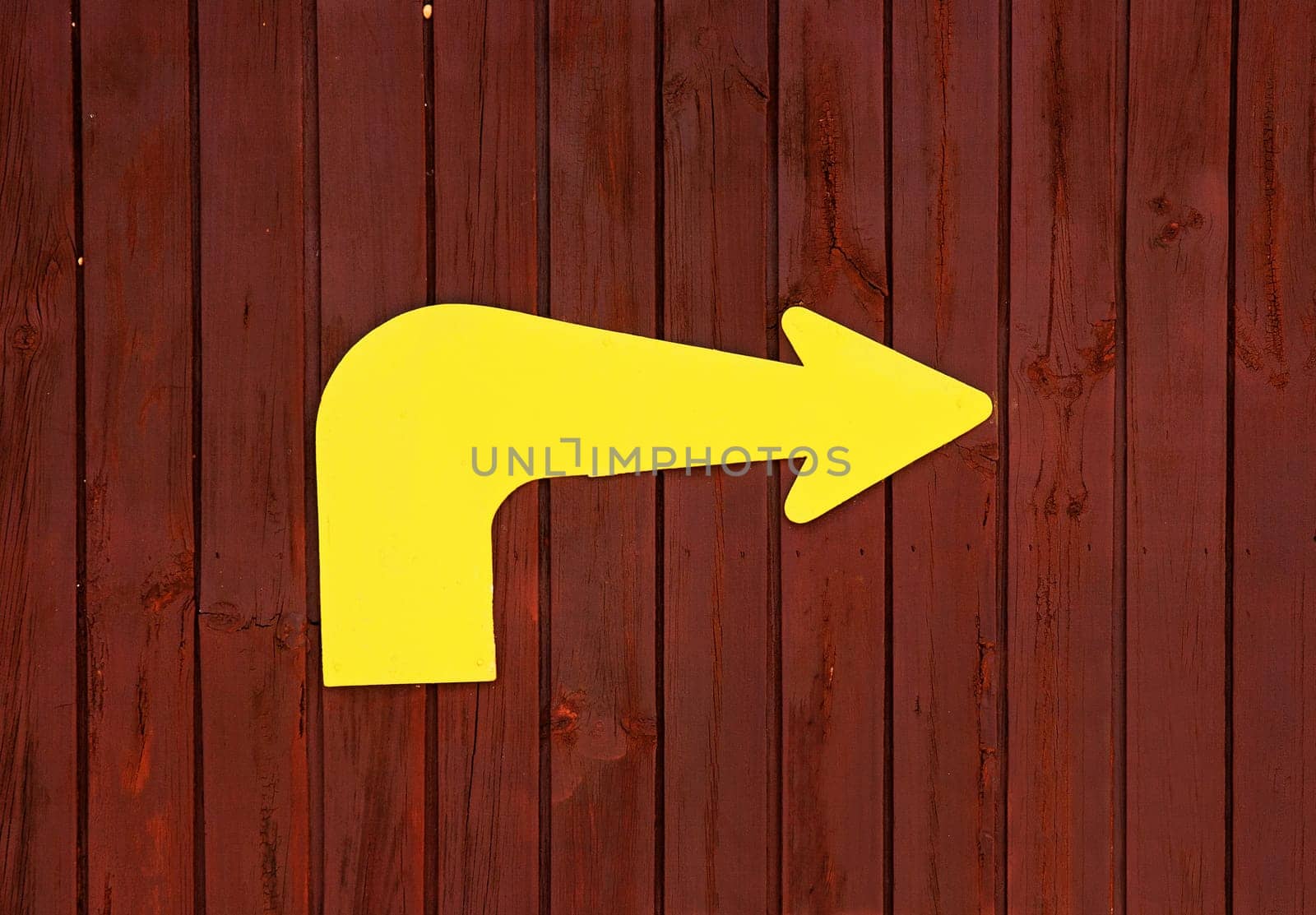 Arrow on wooden background