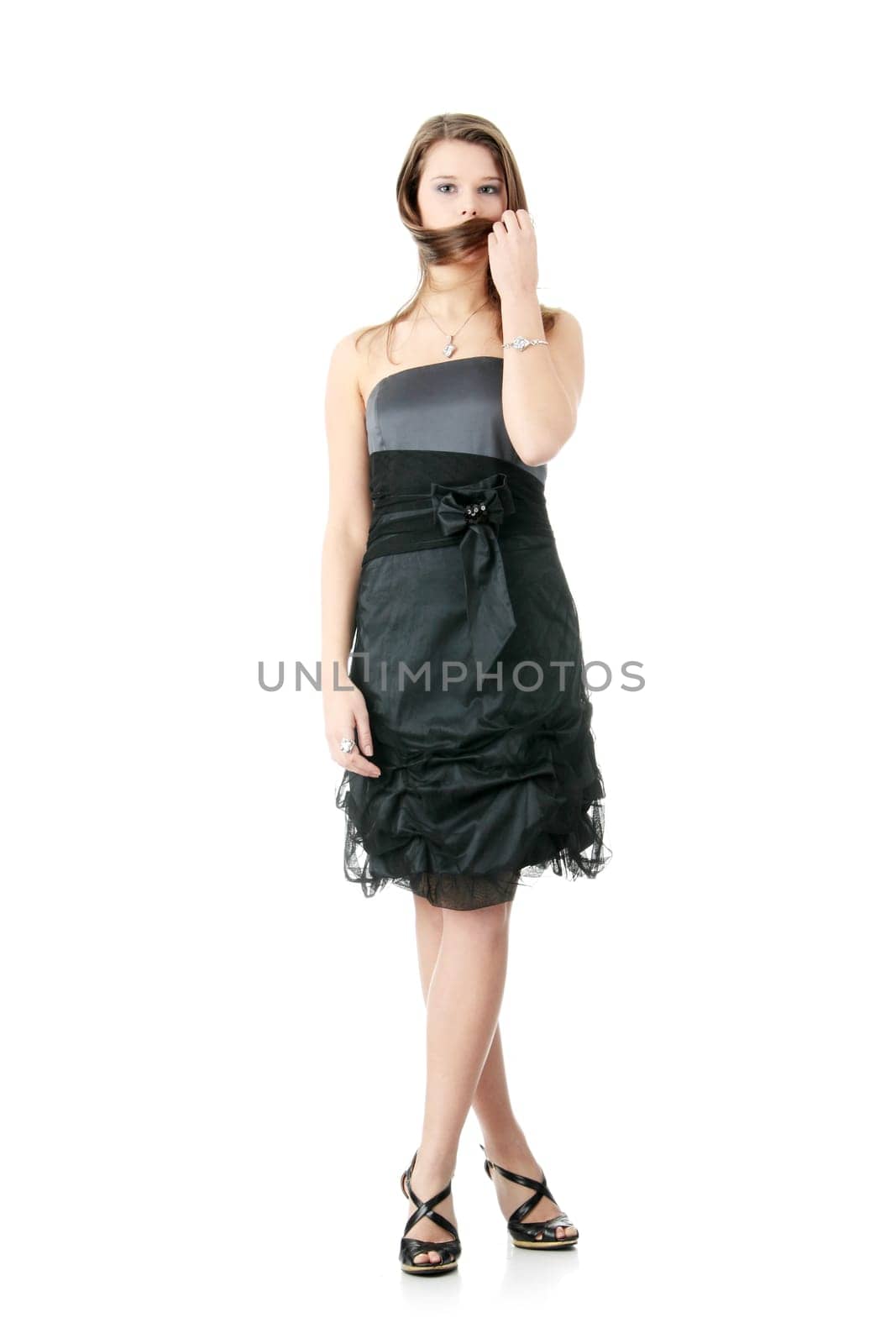 Young elegant woman in black dress, isolated on white