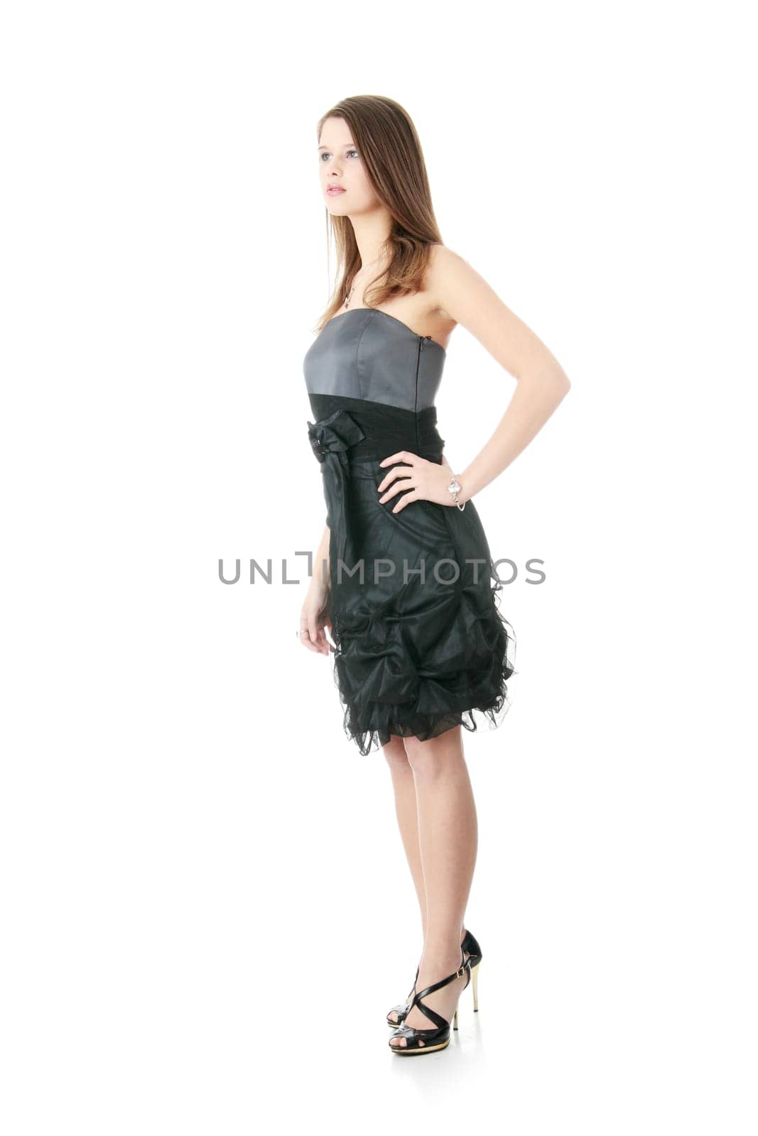 Young elegant woman in black dress, isolated on white